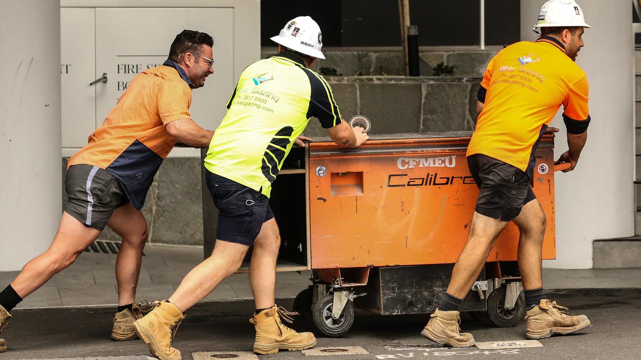 Workers leave the Probuild worksite on 443 Queens Street in Brisbane. Picture: Zak Simmonds