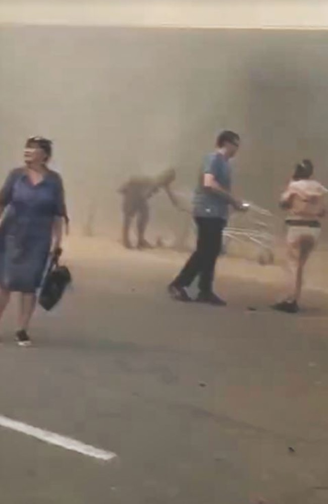 Survivors escape after the mall takes a missile hit.