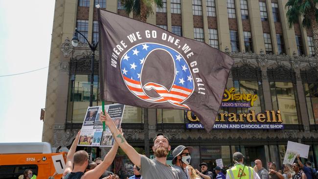 Conspiracy theorist QAnon demonstrators protest child trafficking on Hollywood Boulevard in Los Angeles, California in August last year. Picture: AFP