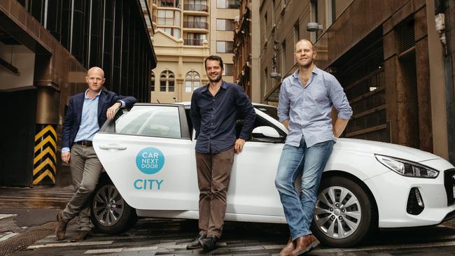 Uber Australia general manager Dom Taylor with Car Next Door’s Dave Trumbull and Will Davies.