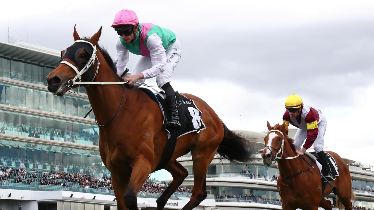 MELBOURNE, AUSTRALIA - OCTOBER 29: James McDonald riding #8 Surefire wins race two the Lexus Archer Stakes during 2022 Penfolds Victoria Derby Day at Flemington Racecourse on October 29, 2022 in Melbourne, Australia. (Photo by Robert Cianflone/Getty Images)