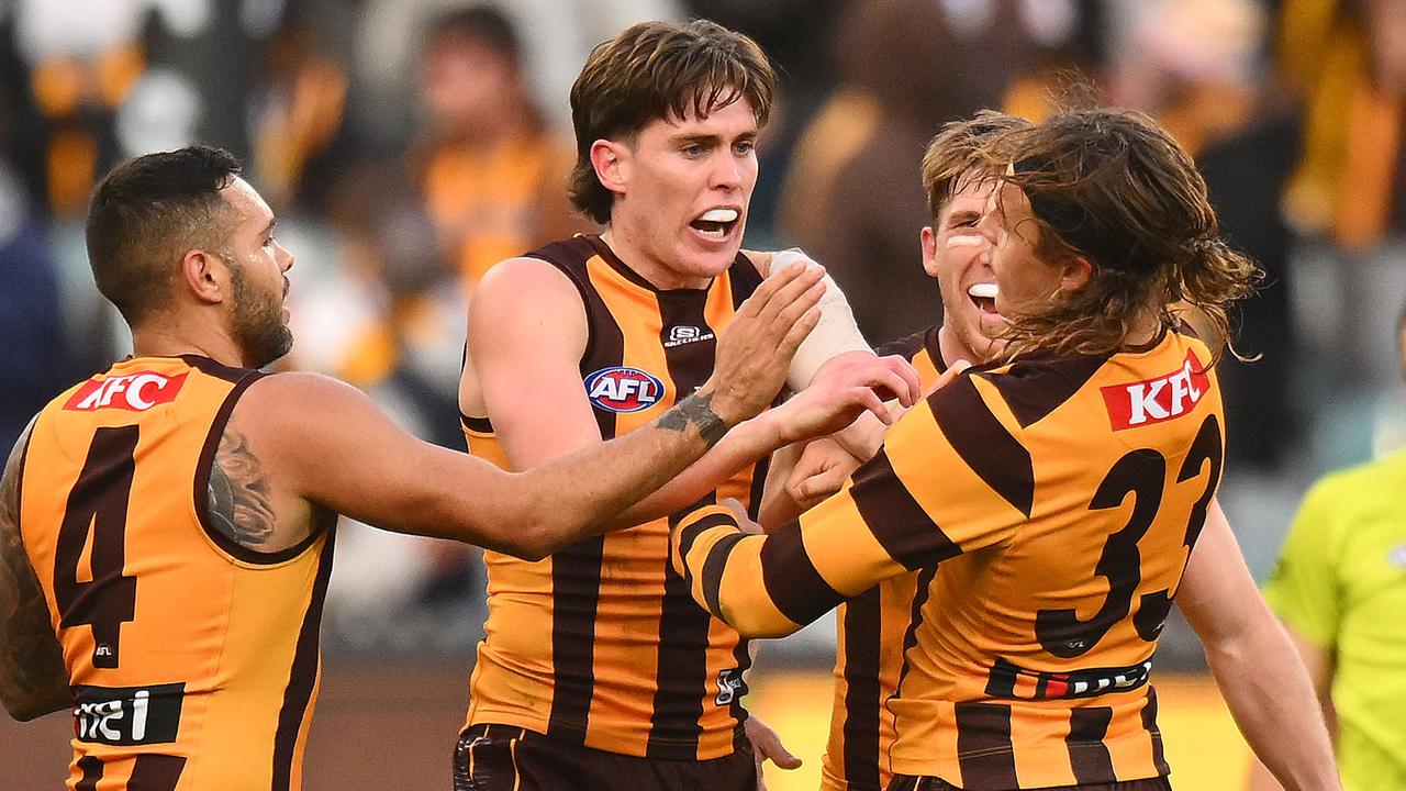 MELBOURNE, AUSTRALIA - JUNE 01: Will Day and Jack Ginnivan of the Hawks react after Ginnivan kicked a goal just before three quarter time during the round 12 AFL match between Hawthorn Hawks and Adelaide Crows at Melbourne Cricket Ground, on June 01, 2024, in Melbourne, Australia. (Photo by Morgan Hancock/AFL Photos/via Getty Images)