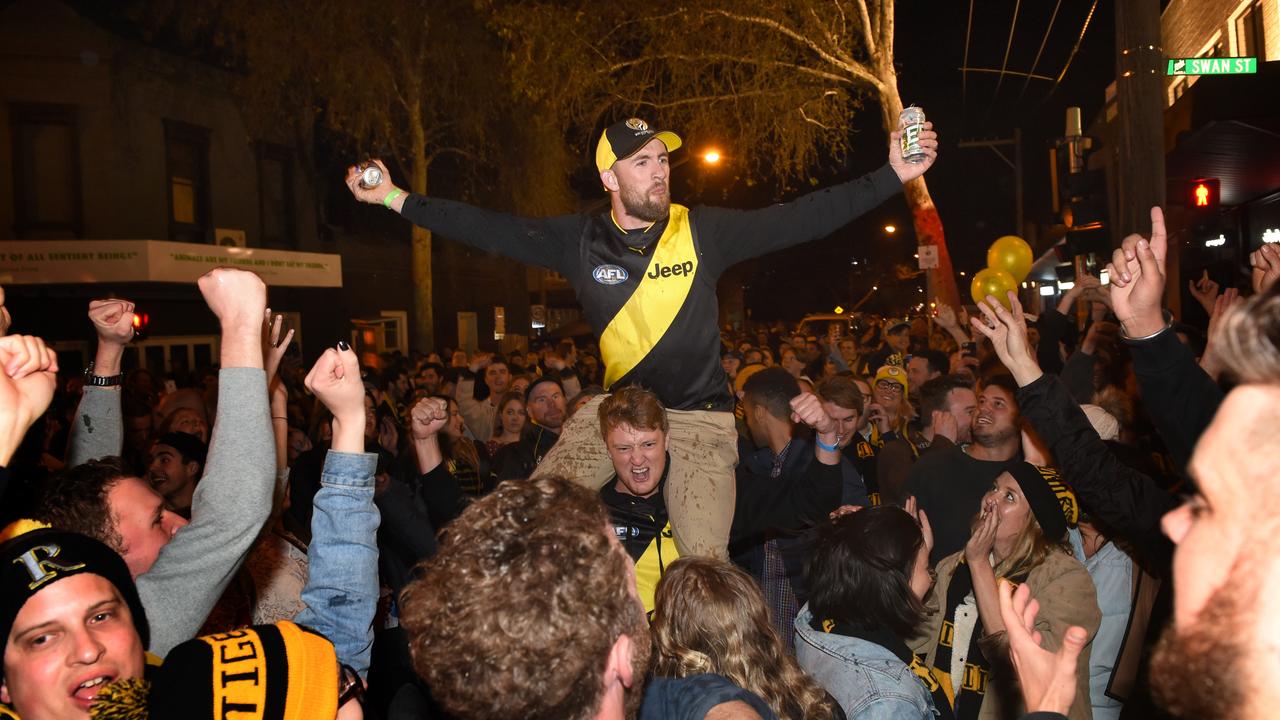 Richmond supporters celebrate the 2019 Grand Final win. Photo: Tony Gough.