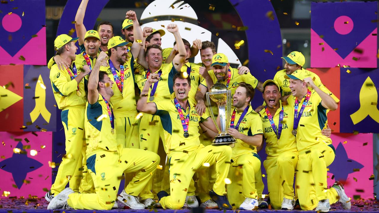 The Australians celebrate with the ICC Men's Cricket World Cup trophy following the final against India at the Narendra Modi Stadium on November 19 in Ahmedabad, India. Picture: Robert Cianflone/Getty Images