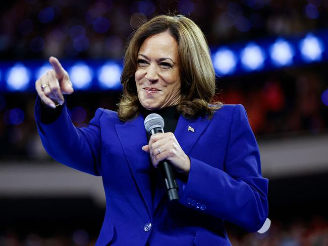 US Vice President and 2024 Democratic presidential candidate Kamala Harris and her running mate Minnesota Governor Tim Walz speaks at the campaign rally at the Fiserv Forum in Milwaukee, Wisconsin, August 20, 2024. (Photo by KAMIL KRZACZYNSKI / AFP)