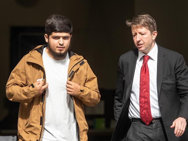 Rajabali Atoev (left) leaves Bankstown Local Court with his lawyer Pawel Kulisiewicz on Tuesday after being sentenced. Picture: Julian Andrews