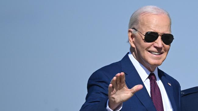 US President Joe Biden waves as he arrives at Joint Base Andrews in Maryland. Picture: AFP.