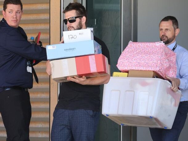 Jake Gliddon helped police carry wrapped gifts. Picture: Jackson Flindell/The West Australian