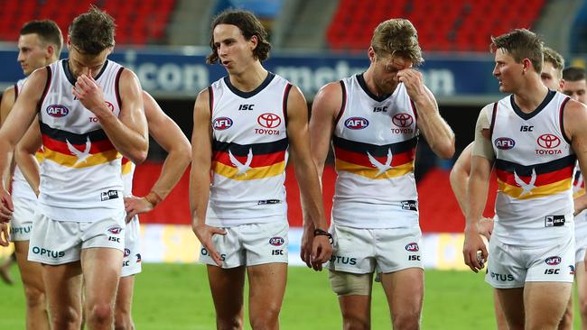 GOLD COAST, AUSTRALIA - JUNE 21: Crows leave the field after losing the round 3 AFL match between the Gold Coast Suns and the Adelaide Crows at Metricon Stadium on June 21, 2020 in Gold Coast, Australia. (Photo by Chris Hyde/Getty Images)