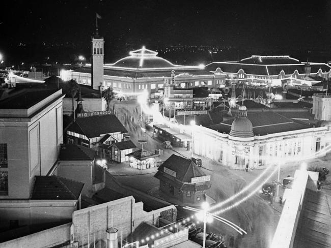 As well as games and rides, at its heyday Sideshow Alley in 1937 included waxworks, illusion shows and animal acts. Picture: Sam Hood/State Library of NSW