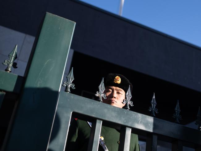 A Chinese paramilitary policeman stands guard at the Australian embassy in Beijing. Picture: AP