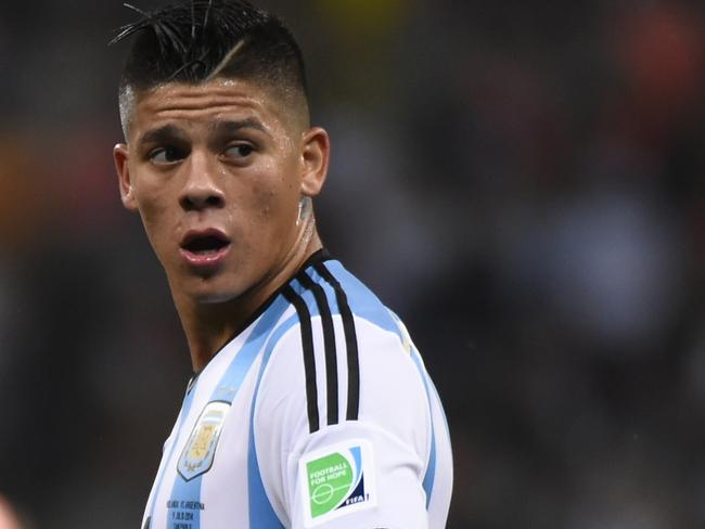 (Files) In this file picture taken on July 9, 2014, Argentina's defender Marcos Rojo reacts during the second half of extra time during the semi-final football match between Netherlands and Argentina at the FIFA World Cup in Sao Paulo. Manchester United completed the 20 million euro signing of Argentina World Cup defender Marcos Rojo from Sporting Lisbon on Wednesday, August 20, 2014, with Old Trafford boss Louis van Gaal hailing the 24-year-old as a "gifted" player. Rojo signed a five-year contract after impressing during the World Cup where he helped Argentina to reach the final. AFP PHOTO / FABRICE COFFRINI