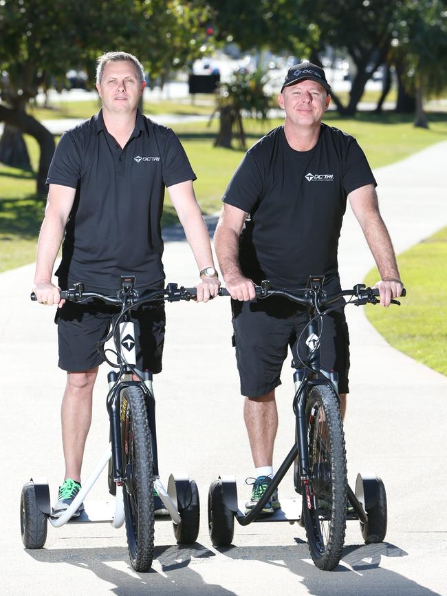 Built for commuting and fun. Owners Dal Seale and Chris O'Neill with trikes at Broadwater Parklands. Picture Glenn Hampson