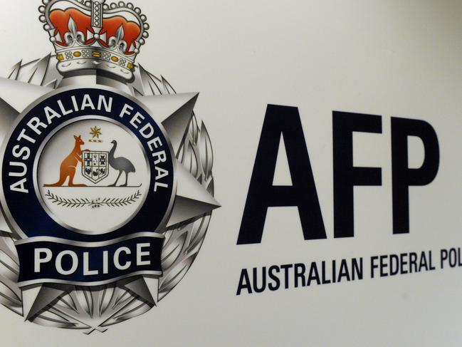 An Australian Federal Police logo is seen in Geelong, Friday, Oct 3, 2014. (AAP Image/Julian Smith) NO ARCHIVING