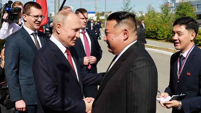 Vladimir Putin and Kim Jong-un shake hands at the Vostochny Cosmodrome in Russia’s Amur region on Wednesday. Picture: AFP