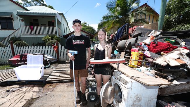 Ned Foster and Taya Dawson cleaning up ion South Lismore after the floods. Picture: Jason O'Brien