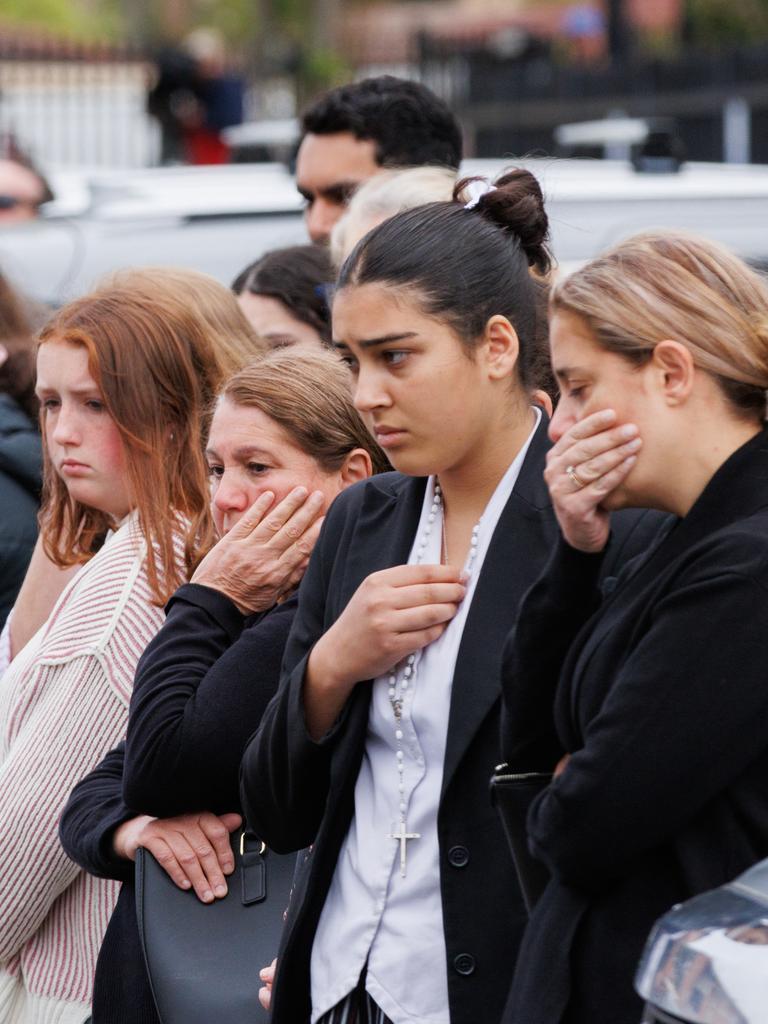 Mourners gather outside after the funeral service. Picture: NewsWire / Max Mason-Hubers