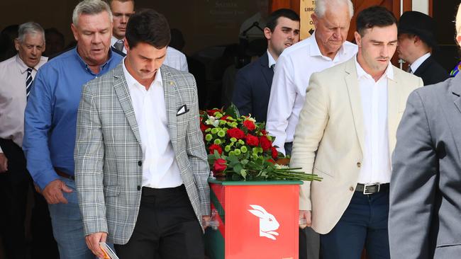 Grandchildren Blake Scott and Jack Sattler, front, Troy McCarthy, and Ron Coote with the casket during the funeral for Souths legend John Sattler on the Gold Coast. Picture: NCA NewsWire/Tertius Pickard