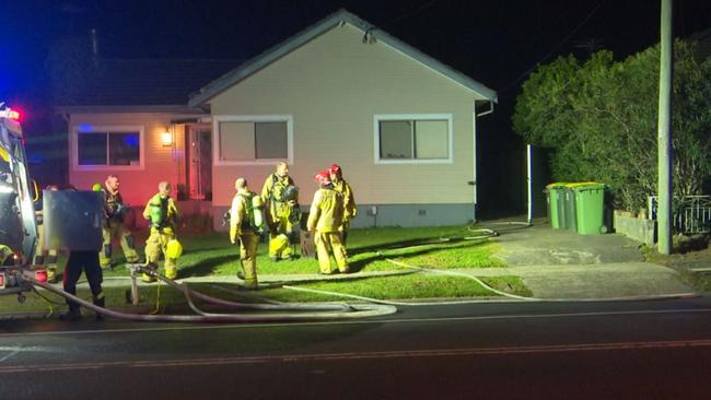 Police and firefighters at the South Wentworthville home. Picture: TNV