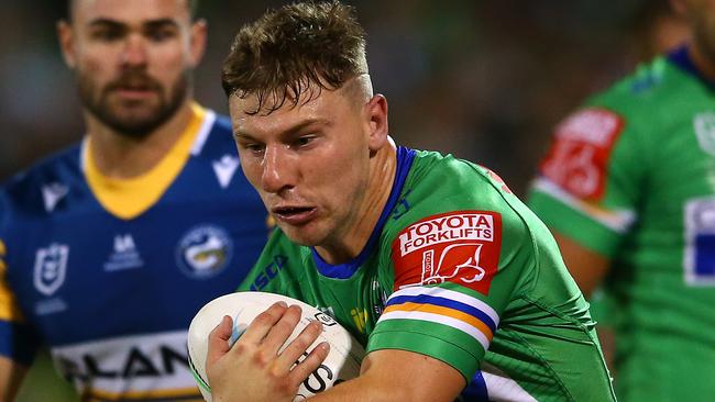 CANBERRA, AUSTRALIA - APRIL 17:  George Williams of the Raiders is tackled during the round six NRL match between the Canberra Raiders and the Parramatta Eels at GIO Stadium on April 17, 2021, in Canberra, Australia. (Photo by Matt Blyth/Getty Images)