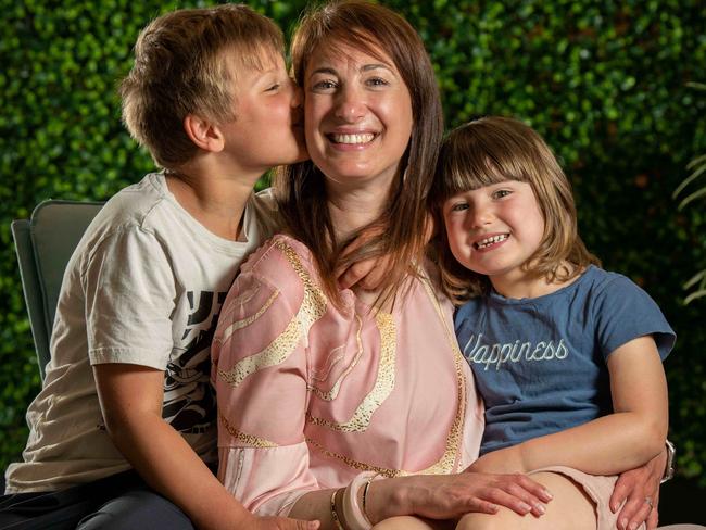 October 11, 2022: Dinah Thomasset with her son Noah, 7 (white t-shirt) and daughter Maeva, 4, at West Lakes library. She is speaking to us for the Tiser's Can We Talk mental health campaign. Dinah struggled with her mental health after becoming a mother and started The Villagehood, a support group for mums, in 2020.. Picture: Naomi Jellicoe