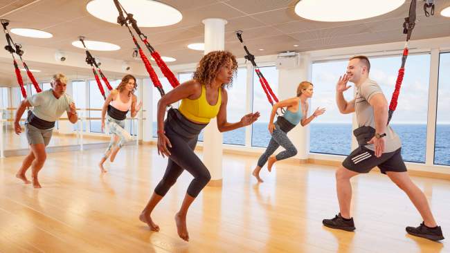 A bungee fitness class onboard a Virgin Voyages cruise.