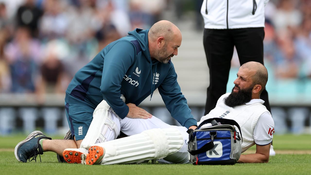 Moeen Ali of England receives treatment for an injury. Photo by Ryan Pierse/Getty Images