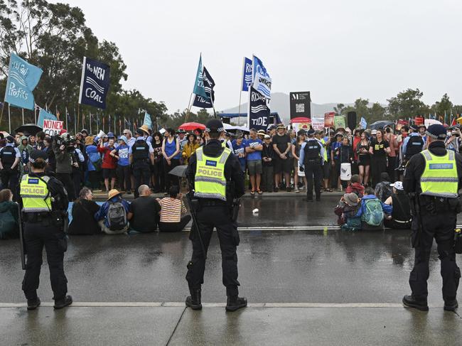 Australian Federal Police stand before the protesters before moving in to make arrests. Picture: NewsWire / Martin Ollman