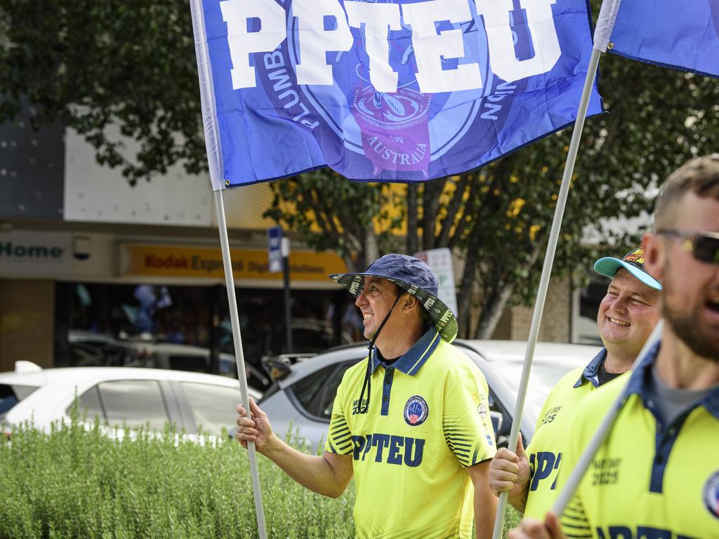 Greg Alexander flys the flag for the PPTEU in the Toowoomba Labour Day March, Saturday, May 3, 2025. Picture: Kevin Farmer