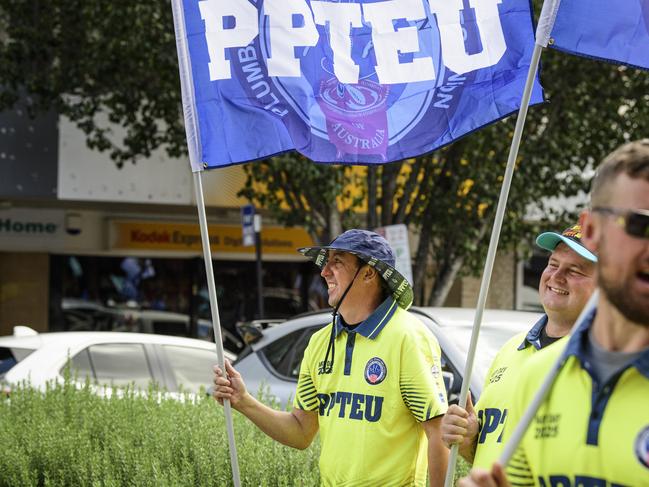 Greg Alexander flys the flag for the PPTEU in the Toowoomba Labour Day March, Saturday, May 3, 2025. Picture: Kevin Farmer