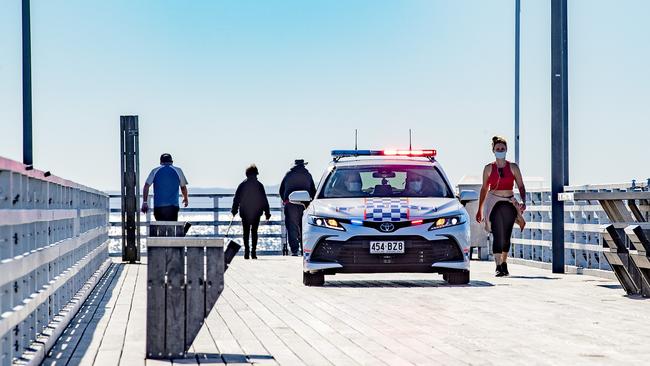 Queensland Police patrolling Shorncliffe Pier looking for anyone who may be in breach of lockdown rules. Picture: Richard Walker