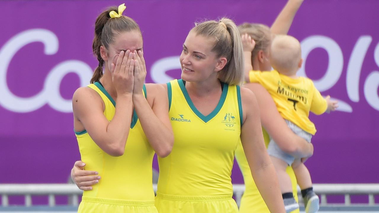 Grace Stewart of Australia (left) is comforted by Ashlea Fey after the gold medal match, (AAP Image/Tracey Nearmy)