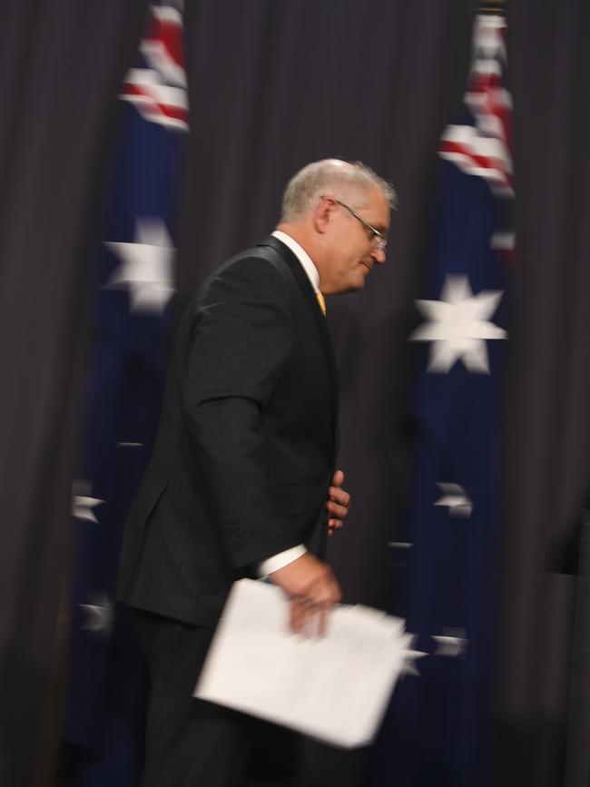 Australian Prime Minister Scott Morrison leaves after a press conference at Parliament House last night. Picture: Getty Images