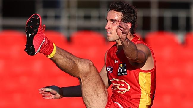 Ben King kicks for goal in Gold Coast’s emphatic victory.