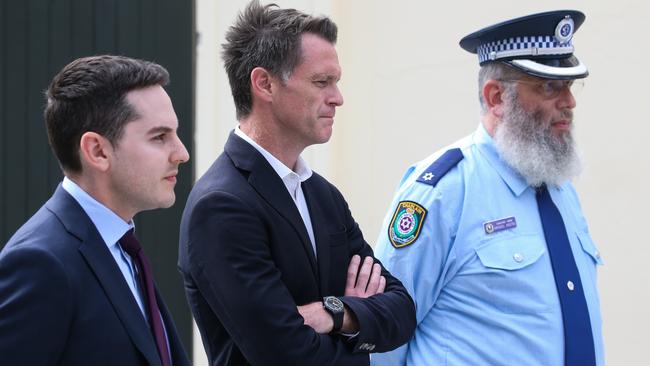 NSW Premier Chris Minns, centre, speaks on Wednesday after the Woollahra anti-Semitic vandalism next to NSW JBD president David Ossip, left, and Jewish House chief executive Rabbi Mendel Kastel. Picture: Gaye Gerard