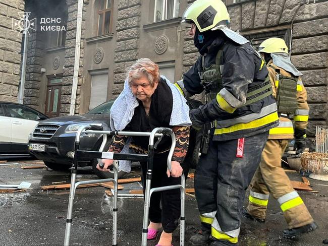 An elderly resident is evacuated from the site of a Russian drone attack on a residential building in Kyiv. Picture: State Emergency Service of Ukraine