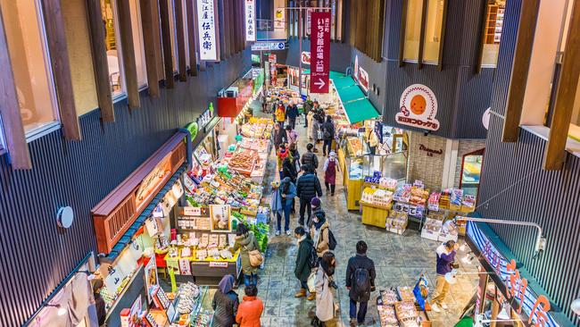 Shoppers peruse fresh seafood at the Omicho Market.