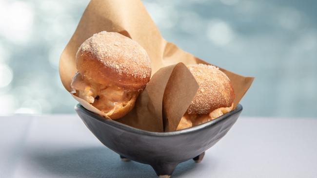 The crab “doughnut” sliders with coral mayo. Picture: Brad Fleet