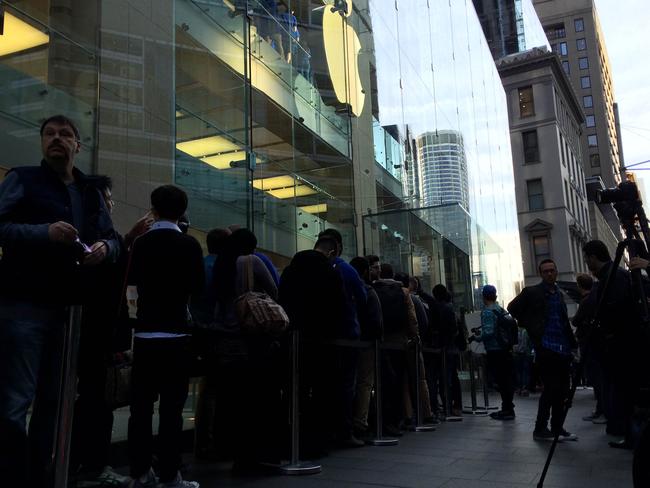 Fans queue outside the Sydney Apple store ahead of the new iPhone going on sale. Picture: Harry Tucker