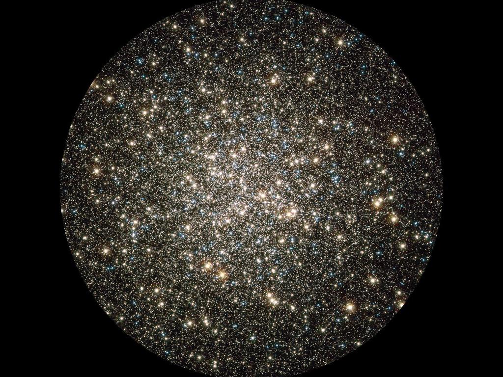 Image obtained 29 Dec 2009 showing a composite of archival Hubble data taken with the Wide Field Planetary Camera 2 and the Advanced Camera for Surveys. Like a whirl of shiny flakes sparkling in a snow globe, Hubble caught this glimpse of many hundreds of thousands of stars moving about in the globular cluster M13, one of the brightest and best-known globular clusters in the northern sky. This glittering metropolis of stars is easily found in the winter sky in the constellation Hercules and can even be glimpsed with the unaided eye under dark skies. M13 is home to over 100,000 stars and located at a distance of 25,000 light-years. These stars are packed so closely together in a ball, approximately 150 light-years across, that they will spend their entire lives whirling around in the cluster.