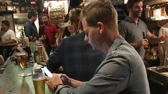 Former skipper Steve Smith checks his phone while having a drink in the Nancy Whiskey Pub. Picture: Backgrid