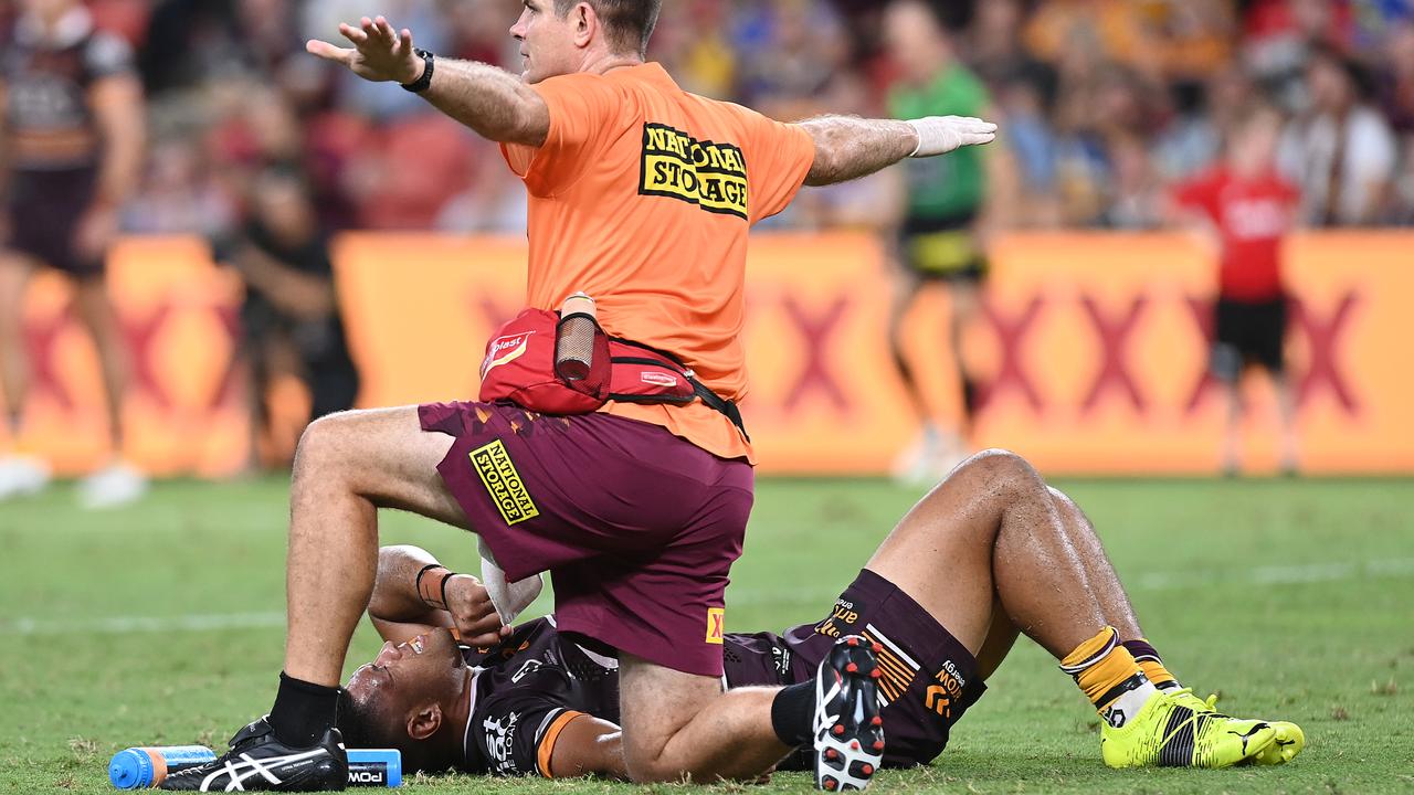 BRISBANE, AUSTRALIA - MARCH 12: John Asiata of the Broncos is assessed after a heavy knock during the round one NRL match between the Brisbane Broncos and the Parramatta Eels at Suncorp Stadium, on March 12, 2021, in Brisbane, Australia. (Photo by Bradley Kanaris/Getty Images)