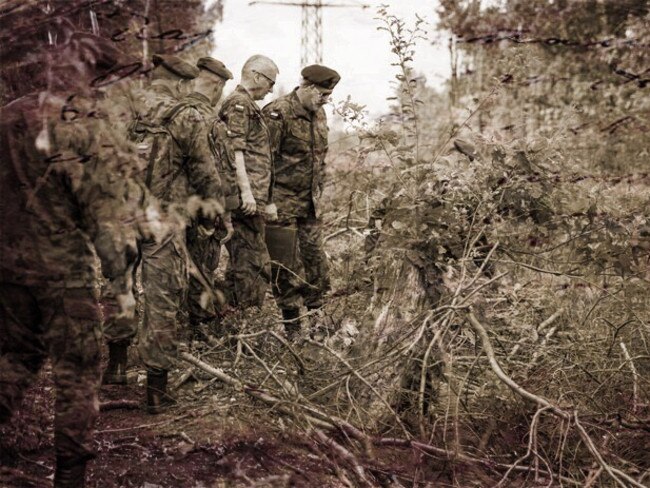 Reconnaissance ... Polish military personnel examine the mound which treasure hunters say contains an armoured Nazi gold train. Source: AP