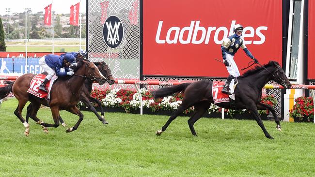 Glen Boss stands high in the irons as Sir Dragonet streaks away with the Cox Plate. Picture: Pat Scala