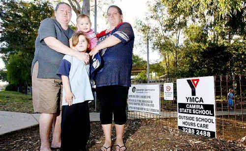 Amanda Glennie (left) and Carlie Brown (right) with Carlie’s children, Mackenzie, 6 and Beeanka, 17 months, outside the Camira State School. Picture: Claudia Baxter