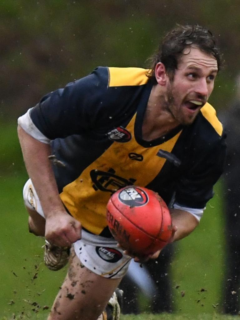 Hurstbridge and Montmorency do battle in tough conditions in Northern FL. Pictures: Nathan McNeill.