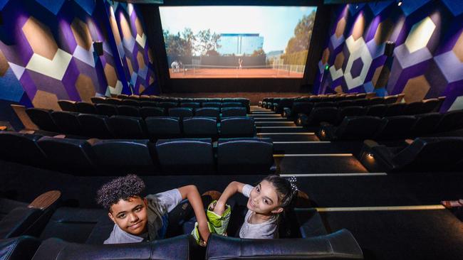 Andre and Lucy, both 11, enjoy some popcorn at the new Palace Nova Prospect Cinema. Picture: AAP/Roy VanDerVegt