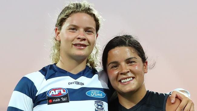 Madison Prespakis of the Blues and Georgie Prespakis of the Cats pose for a portrait after the match during the round two AFLW match between the Geelong Cats and the Carlton Blues at GMHBA Stadium on January 15, 2022 in Geelong, Australia. (Photo by Kelly Defina/Getty Images)