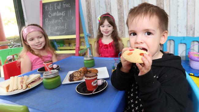 Tahlia Marsh, Annabella Marsh and Eli Takimoana enjoy the kid-friendly treats at Cafe Tahbella. Picture: Richard Gosling