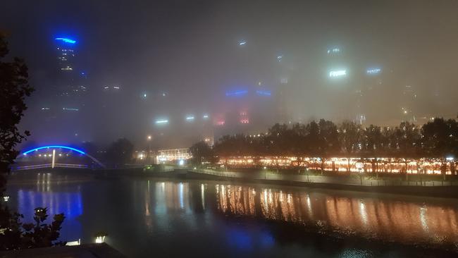 Thick fog blankets Melbourne's CBD. Picture: Ed Gardiner